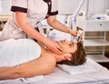 Ultrasound therapy for male skin tightening in beauty spa salon