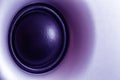 Ultraviolet toned audio speaker or subwoofer dynamic, abstract tech background in ultra violet