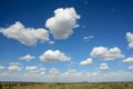 Uluru, horizon and clouds, outback Australia