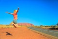 Uluru woman jumping Royalty Free Stock Photo