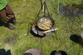 Ulyanovsk, Russia - July 16, 2022: Food is cooked on fire in a pot. Historical reconstruction. Middle Ages