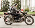 Ulyanovsk, Russia - May 03 2019: Biker on retro military motorcycle ride a traditional show dedicated to the opening of