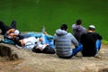 Young men, Hasidim Jews resting on a big stone in Sophia`s park during the Jewish New Year.