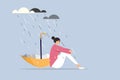 A depressed girl sitting in the rain with an upside down umbrella