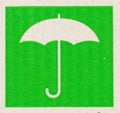 Umbrella image of fragile symbol on cardboard.