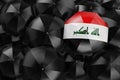 Umbrella with Iraqi flag among black umbrellas, 3D rendering