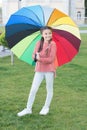 Umbrella for little happy girl. Rainbow after rain. cheerful child. Spring style. Positive mood in autumn rainy weather