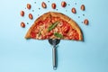 Umbrella made of pizza on blue background