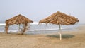 Umbrella and palapa on the beach Royalty Free Stock Photo