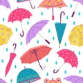 Umbrella and rain drops seamless pattern. Hand drawn doodle umbrellas, autumn or spring season weather. Abstract cute