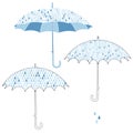 Umbrellas in the rain. Vector set. Three isolated elements for design. Royalty Free Stock Photo