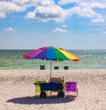 Umbrella with relaxing chairs on a beach. Royalty Free Stock Photo