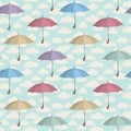 Umbrella seamless pattern. Cloudy sky tiling pattern. Rainy weather ornamental background Royalty Free Stock Photo