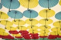 Umbrella sky project installation. Umbrellas float in sky on sunny day. Outdoor art design and decor. Holiday and