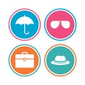 Umbrella, sunglasses and hat with case. Royalty Free Stock Photo