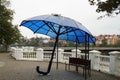 An umbrella for tourists, under which there is a USB charger for the phone and other mobile devices