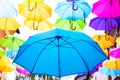 Umbrellas in the air . bright small streets of the city Royalty Free Stock Photo