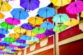 Umbrellas in the air . bright small streets of the city Royalty Free Stock Photo