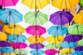 Umbrellas in the air . bright small streets of the city Royalty Free Stock Photo