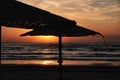 Umbrellas on the beach of Navodari at sunrise Royalty Free Stock Photo