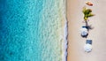 Umbrellas, Beach and ocean as a background from top view. Azure water background from top view. Summer seascape from air. Royalty Free Stock Photo
