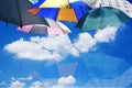 Umbrellas on blue sky and clouds background with reflect Royalty Free Stock Photo