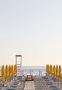 Umbrellas and chairs on a bathing establishment Royalty Free Stock Photo