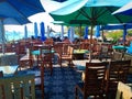 Umbrellas, chairs and tables in the outside restaurant are clean and ready for customers Royalty Free Stock Photo