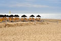 Umbrellas and chaise lounges on beach. Agadir. Morocco