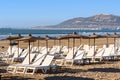 Umbrellas and chaise lounges on beach. Agadir. Morocco