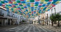 Umbrellas of different colors in the sky