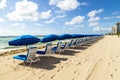 Umbrellas and empty beach couches Royalty Free Stock Photo