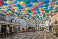 Umbrellas floating in the sky with lots of color in ÃÂgueda, Portugal