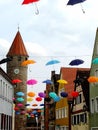 Umbrellas are hanging in the street in little town in germany