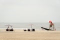 Umbrellas and lifeguard stand on the beach, at Jacob Riis Park, in the Rockaways, Queens, New York City Royalty Free Stock Photo