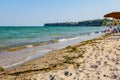 Umbrellas with loungers, chaise are placed next to the coastline Royalty Free Stock Photo