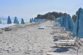 Umbrellas and plank beds on the beach in the summer sunny day Royalty Free Stock Photo