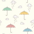 Umbrellas and rainy clouds background