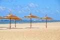 Umbrellas on sandy beach at hotel in Marsa Alam - Egypt Royalty Free Stock Photo