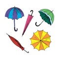 Umbrellas set. Collection of isolated painted colored umbrellas. Multicolor bright doodle illustration. Hand drawn Royalty Free Stock Photo