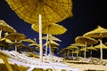 Umbrellas and sun loungers on the beach at night, Tunisia, Mediterranean sea Royalty Free Stock Photo