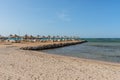 Umbrellas and sun loungers on an empty beach in Makadi Bay, which one of Egypt beautiful Red Sea Riviera Royalty Free Stock Photo