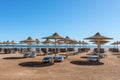 Umbrellas and sun loungers on an empty beach in Makadi Bay, which one of Egypt beautiful Red Sea Riviera Royalty Free Stock Photo