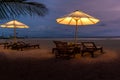 Umbrellas and sunbeds on the beach at night