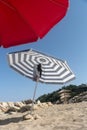 Umbrellas stack on the sand