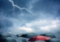 Umbrellas under rain and thunderstorm Royalty Free Stock Photo