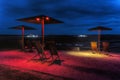 Umbrellas at the viewpoint of the Hambach brown coal mine at night, in Elsdorf, Germany Royalty Free Stock Photo