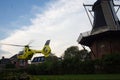 UMCG Air Ambulance Helicopter landing in village