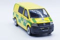 Worn toy ambulance car in yellow and green on white background Royalty Free Stock Photo