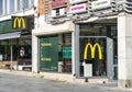 UMEA, SWEDEN - JUNE 10, 2020: Two bright classical yellow McDonalds Logos in Umea downtown on Radhustorget Square, sunny summer Royalty Free Stock Photo